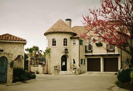 Stone-built Mediterranean style house with lush surroundings in Dallas, Texas.